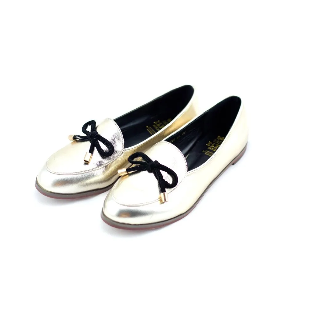 Oscar gold with a feminine bow loafers